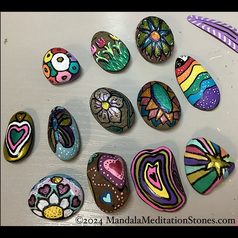 a batch of hand-painted stones