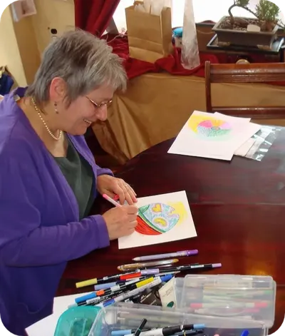 Maureen Frank the Mandala Lady coloring a mandala