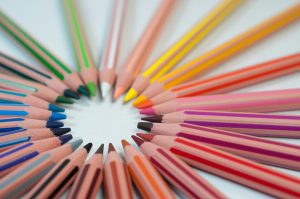many colored pencils in a spoke formation